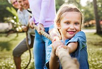 Family playing tug of war