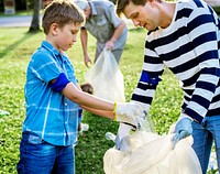 Kids picking up trash in the park