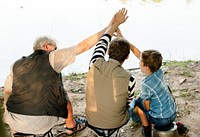 Family making a high five while fishing