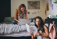 Girl friends studying in the bedroom