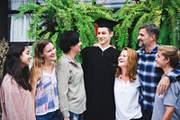 Teen graduate with his family