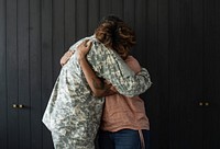 Military husband hugging his wife
