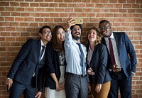 Business people taking a group selfie together