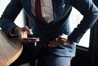 Businessman using a smartphone in a cafe