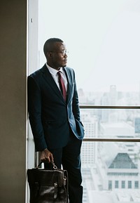 African American businessman portrait with cityscape