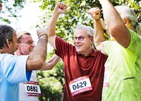 Group of cheerful senior runners at the park