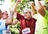 Group of cheerful senior runners at the park