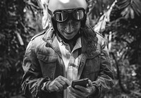 Senior biker using a mobile phone