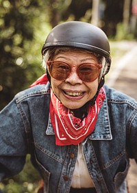 Happy woman riding a classic scooter