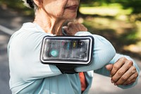 Senior runner using a fitness tracker