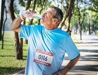 Senior man refreshing with water