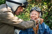 Senior couple riding a classic scooter