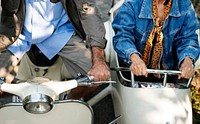 Senior couple riding a classic scooter