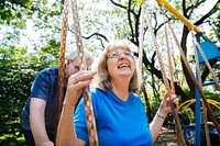 Senior couple playing at a playground