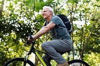 Senior man biking in the park