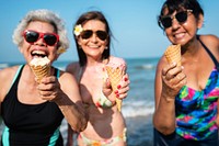 Senior friends enjoying the beach in the summertime