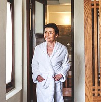 Mature woman in a bathrobe at a resort