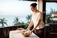 Masseuse preparing massage table