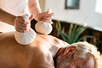 Massage therapist massaging at a spa