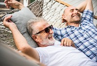 Senior men chilling on a hammock