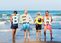 Senior friends having fun at the beach