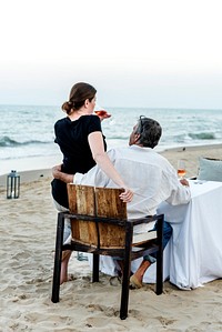 Couple enjoying a romantic dinner at the beach