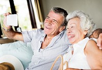 A senior couple taking a selfie