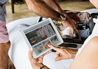 Senior woman using a tablet on the bed