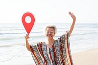 Senior Asian woman checking in at the beach