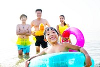 A cheerful kid in a float tube swimming