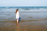 Little girl walking in the water