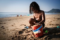 Little kid playing at the beach