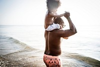 Family playing together at the beach