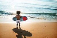 Little kid playing at the beach