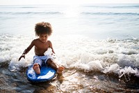 Little kid playing at the beach