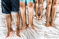 Family chilling on the bed