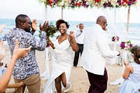 African American couple getting married at the beach