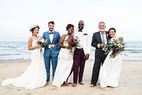 Three newly wed couples on the beach