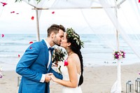 Young couple kissing at wedding reception