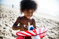 African little boy playing at the beach