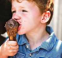 Cute kid having chocolate ice cream