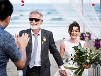 Senior couple getting married at the beach