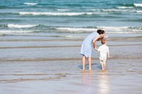 Mother and son chilling at the beach