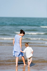 Mother and son chilling at the beach