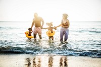 Family playing together at the beach