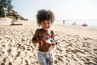 Little kid playing at the beach