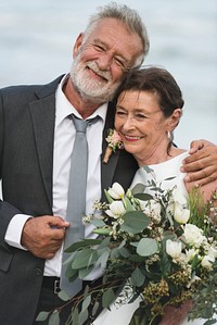 Senior couple getting married at the beach