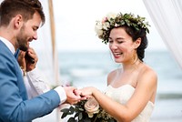 Young couple in a wedding ceremony at the beach