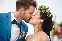 Young couple in a wedding ceremony at the beach