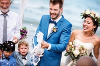 Young couple in a wedding ceremony at the beach